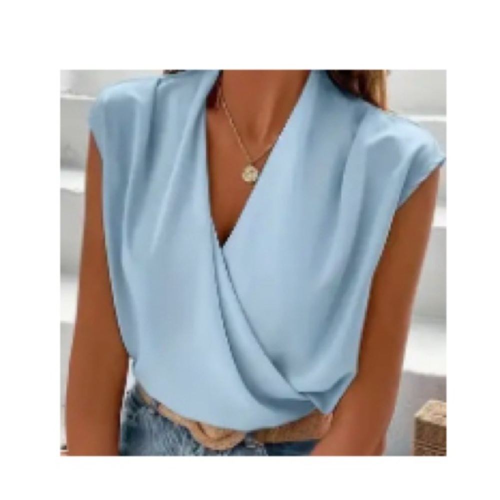 Rayon light Blue Ladies Dress Shirt. Pretty pleats & cap sleeves.